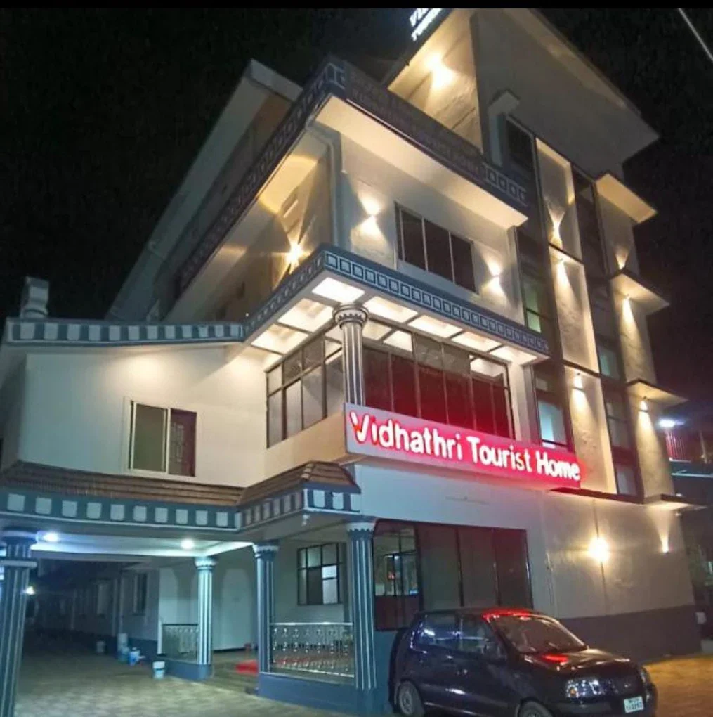 Vidhathri Tourist Home building at night